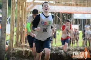 Charter Tax take part in Tough Mudder 2016: Man running through electric shock segment