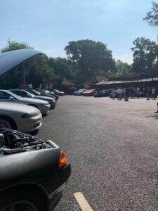 Sports cars lined up in a car park